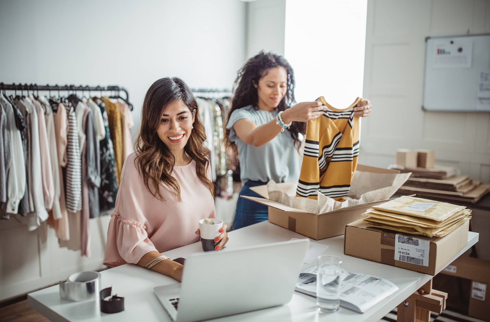 two women fulfilling orders from their ecommerce website two women fulfilling orders from their ecommerce website