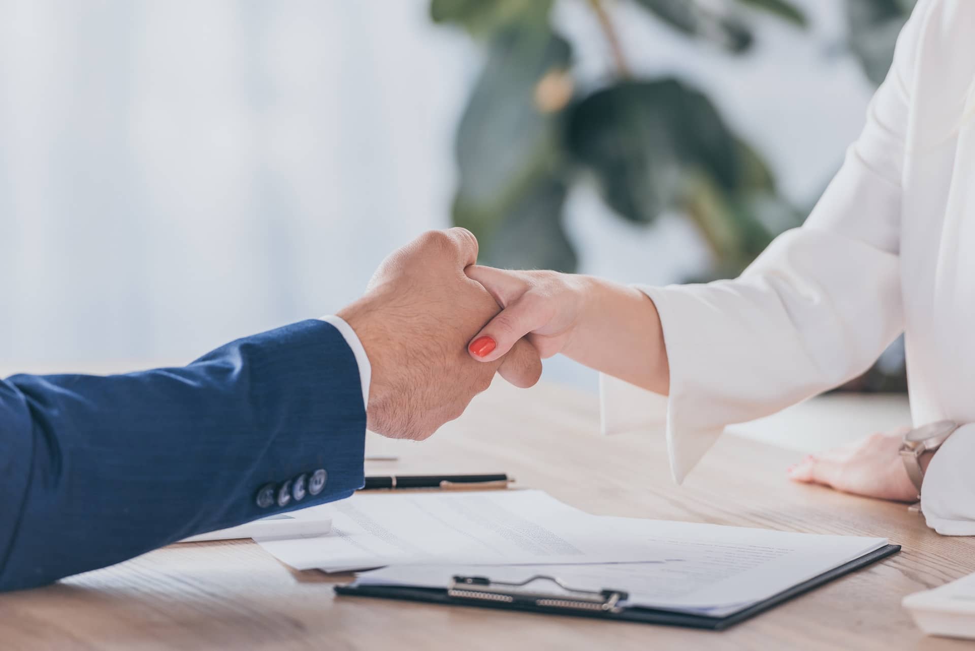 shaking hands after receiving a small business insurance quote