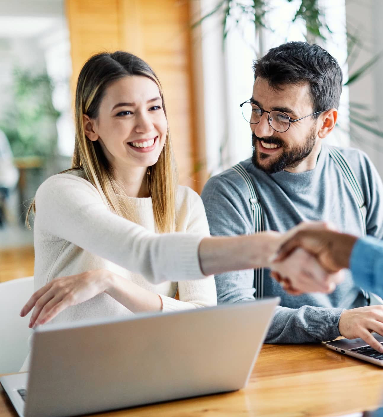 lady shaking hands with an insurance broker